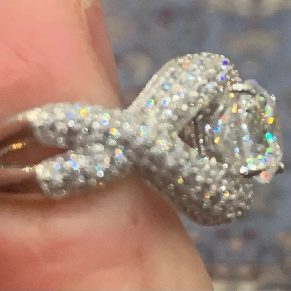 Unique and lovely solitaire style with a wrap effect size 8. CZ and silver